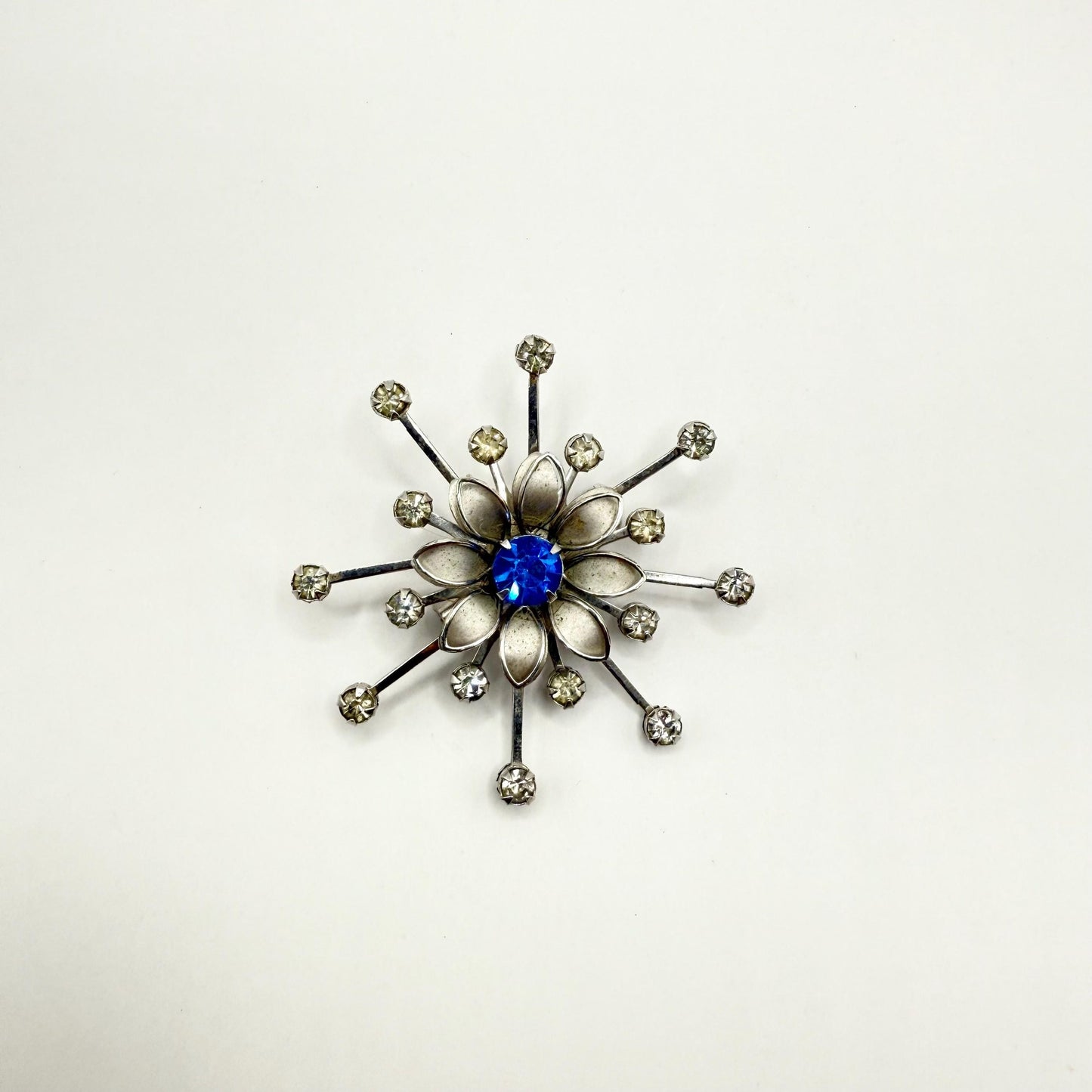 Vintage Brooch in Silver Flower Starburst Design with Blue Rhinestone Center