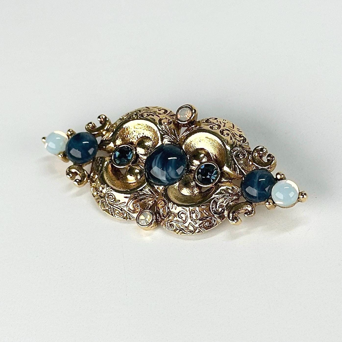 Vintage Brooch in Gold Tone Design with Blue Opalescent Stones