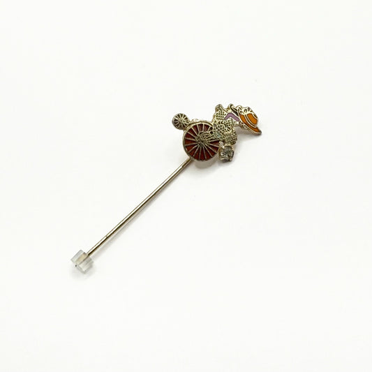 Vintage Stickpin of Girl on Bike With Flower Basket Detail