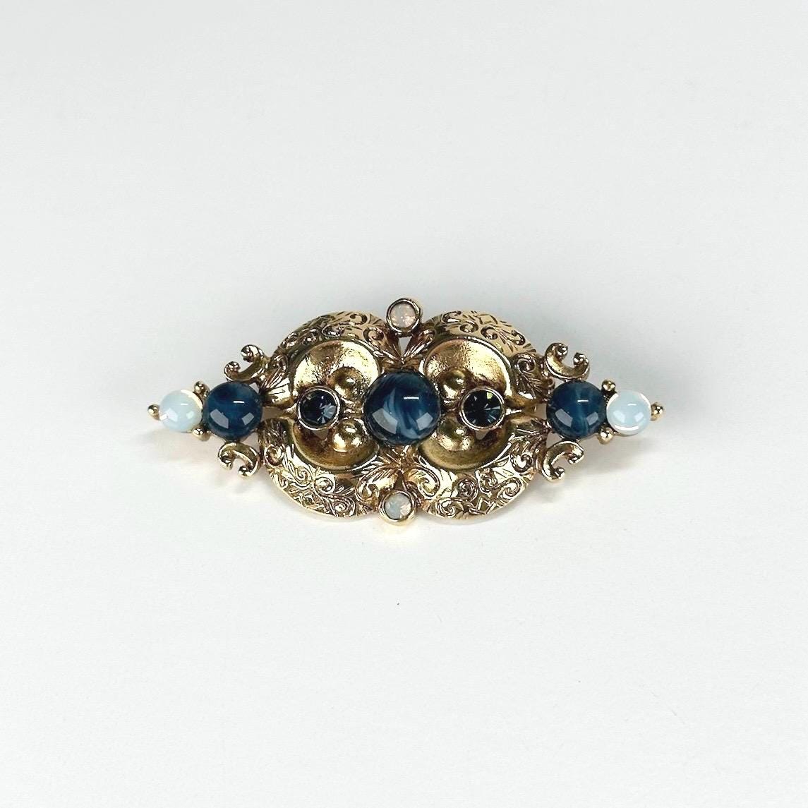 Vintage Brooch in Gold Tone Design with Blue Opalescent Stones