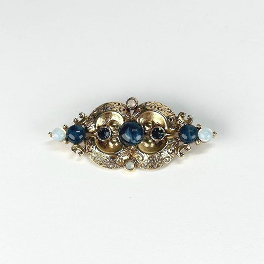 Vintage Brooch in Gold Tone Design with Blue Opalescent Stones