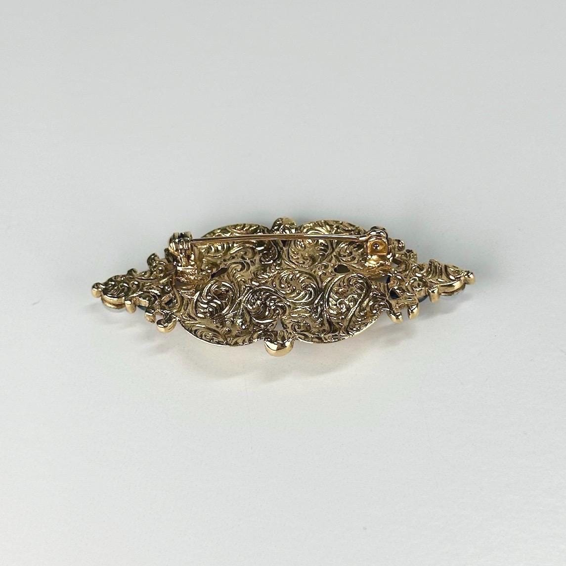 Vintage Brooch in Gold Tone Design with Blue Opalescent Stones