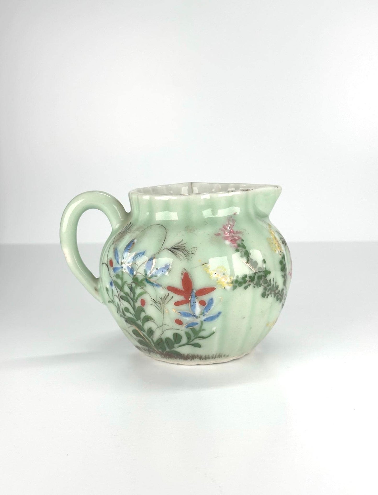 Antique Pitcher Made of Celadon Glazed Porcelain with Hand Painted Floral Design