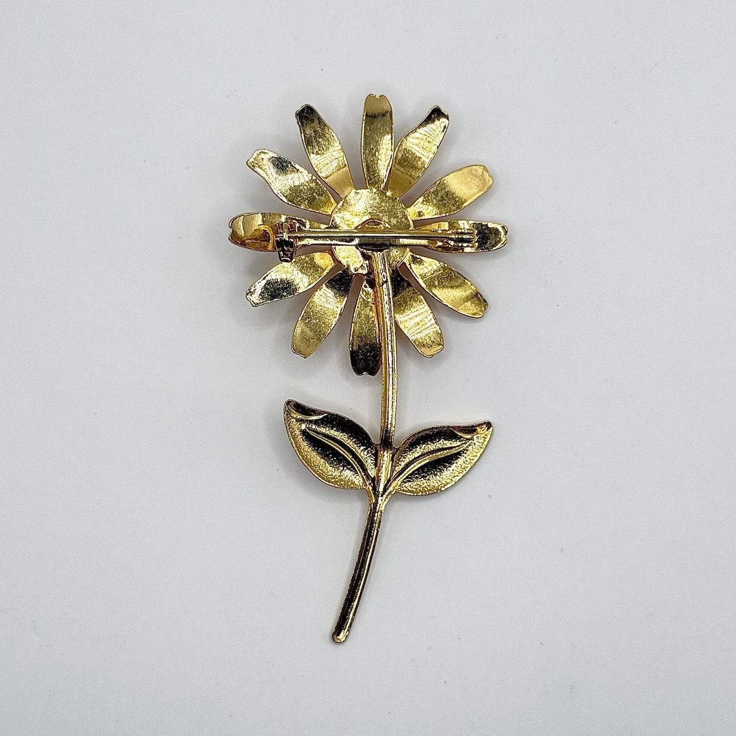 Vintage Metal Daisy Brooch in Gold Tone with Red Enamel Center