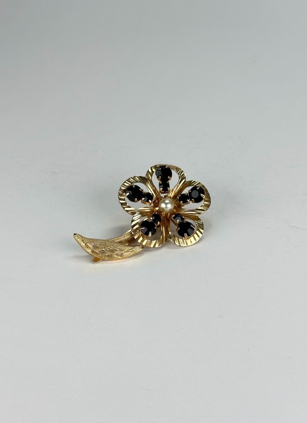 Vintage Hair Clip of Gold Tone Flower with Black Rhinestones and Faux Pearl Center