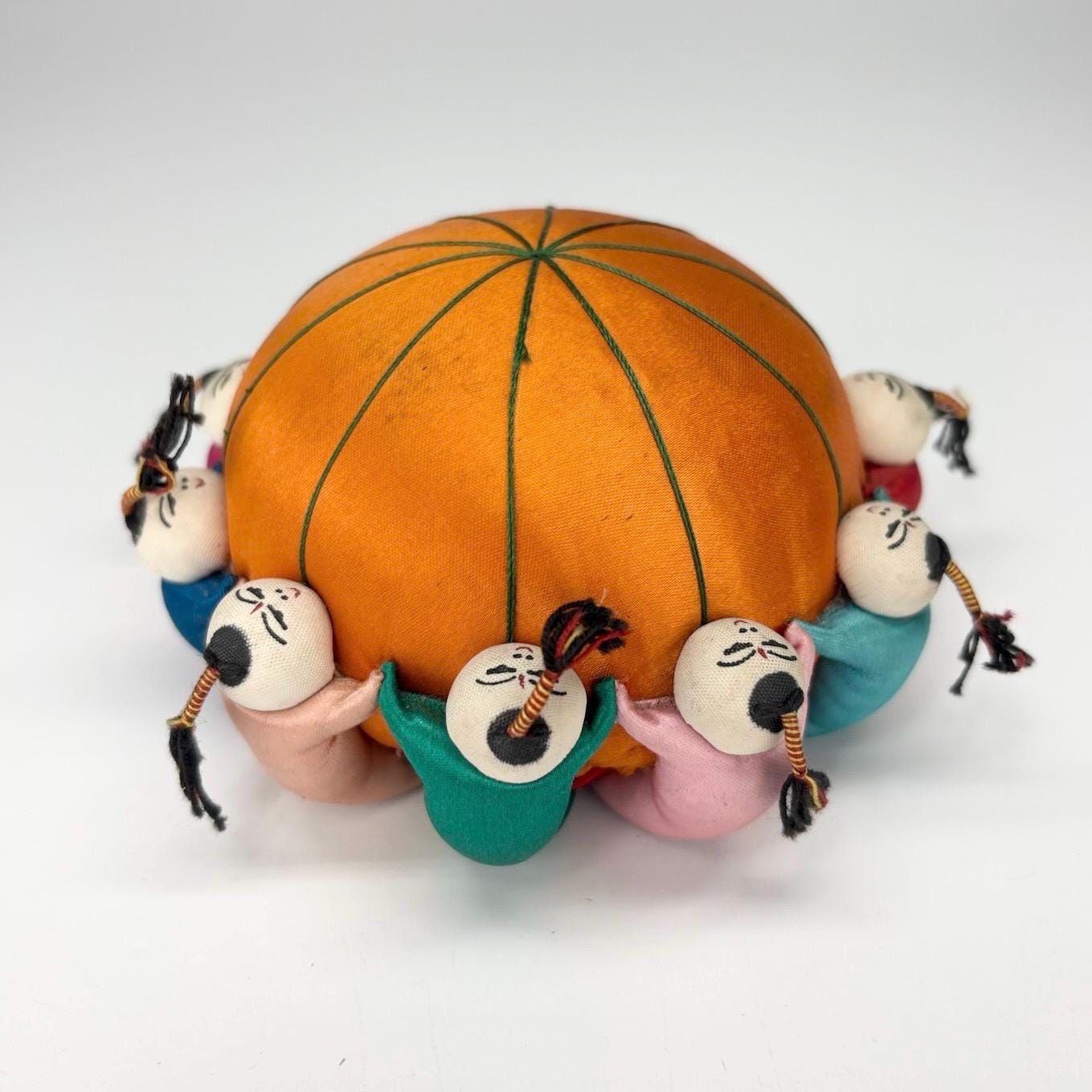 Vintage Pin Cushion with Orange Silk and Children Playing & Made in China