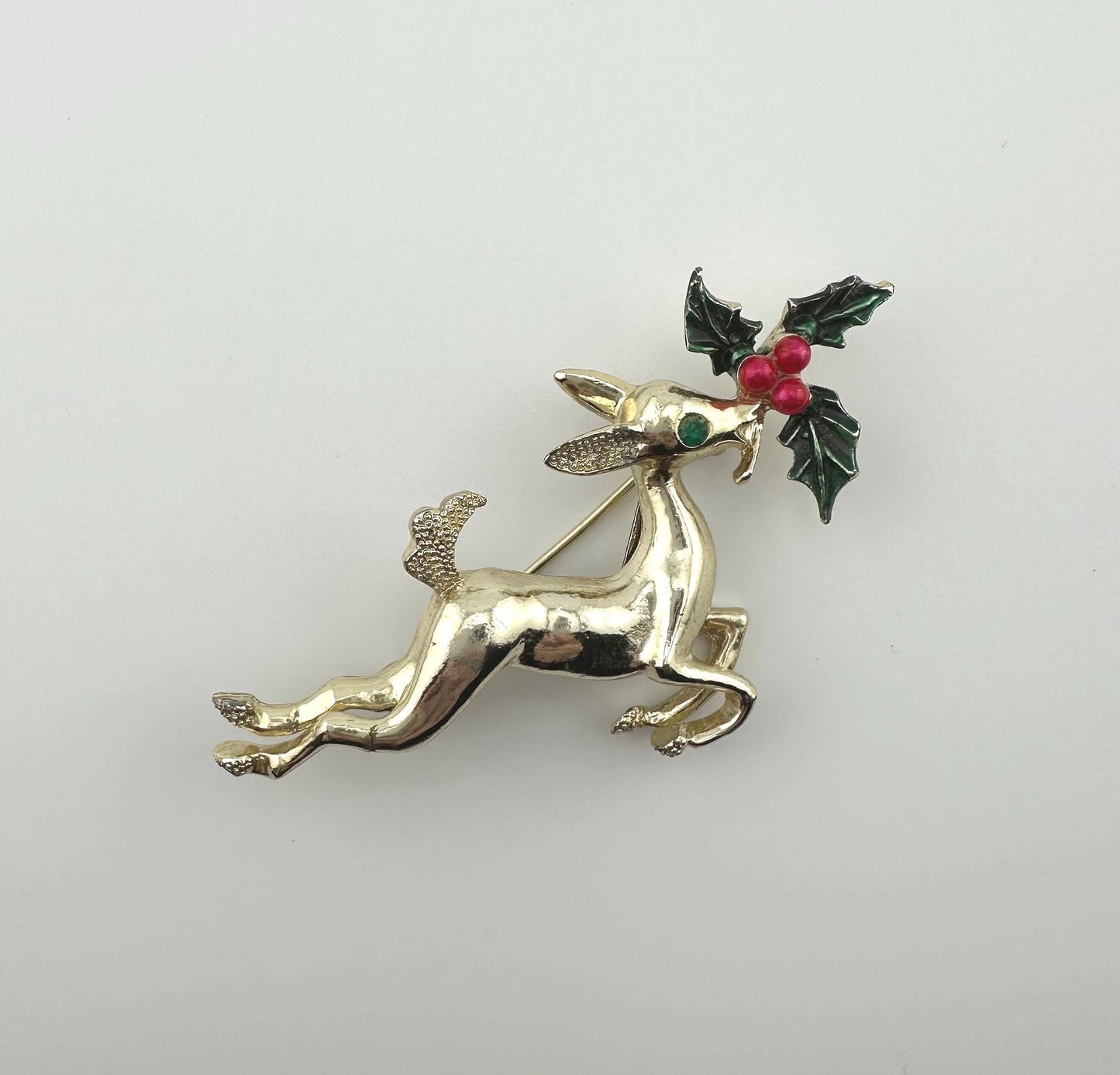 Vintage Leaping Reindeer Christmas Brooch, Gold Tone with Holly Leaves.