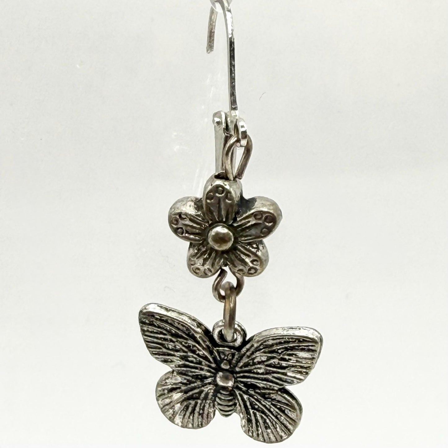 Metal Dangle Earrings in Silver Tone with Flower and Butterfly Design