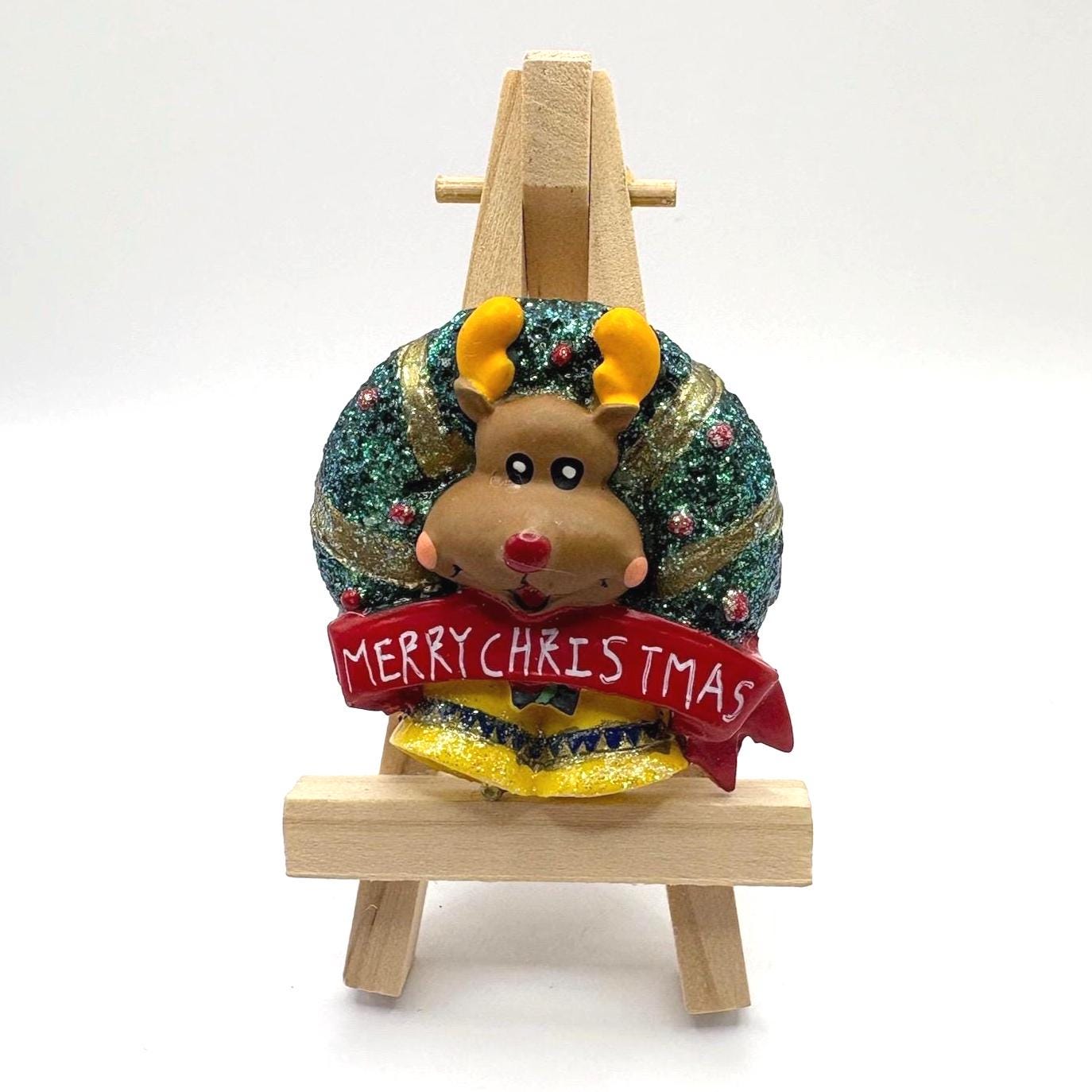 Vintage Brooch of a Reindeer with a Wreath and Bells that Reads ‘Merry Christmas’